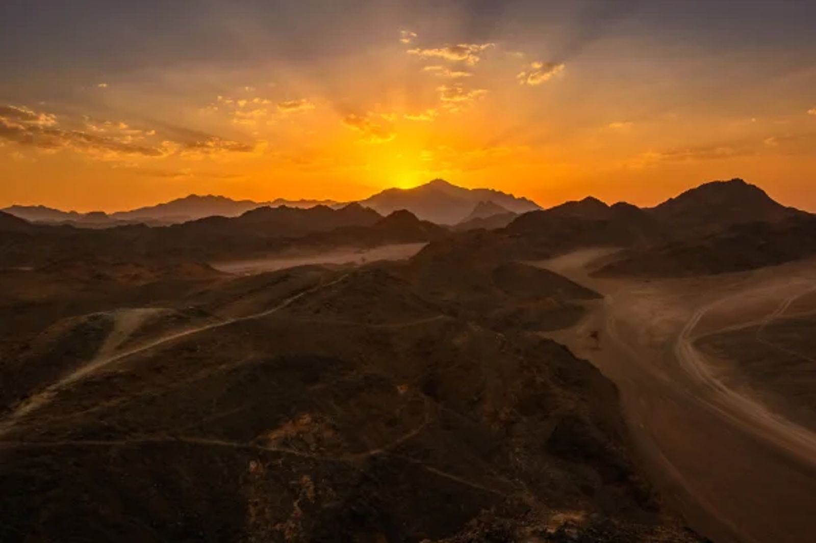 Egyptian desert landscape with sand dunes at sunset