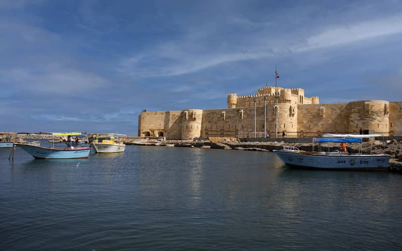 Boats moored in the harbour in front of Qaitbay Citadel, Alexandria
